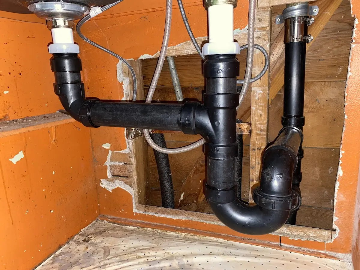 Professional Garbage Disposal Repair equipment and tools on the job in Rendon